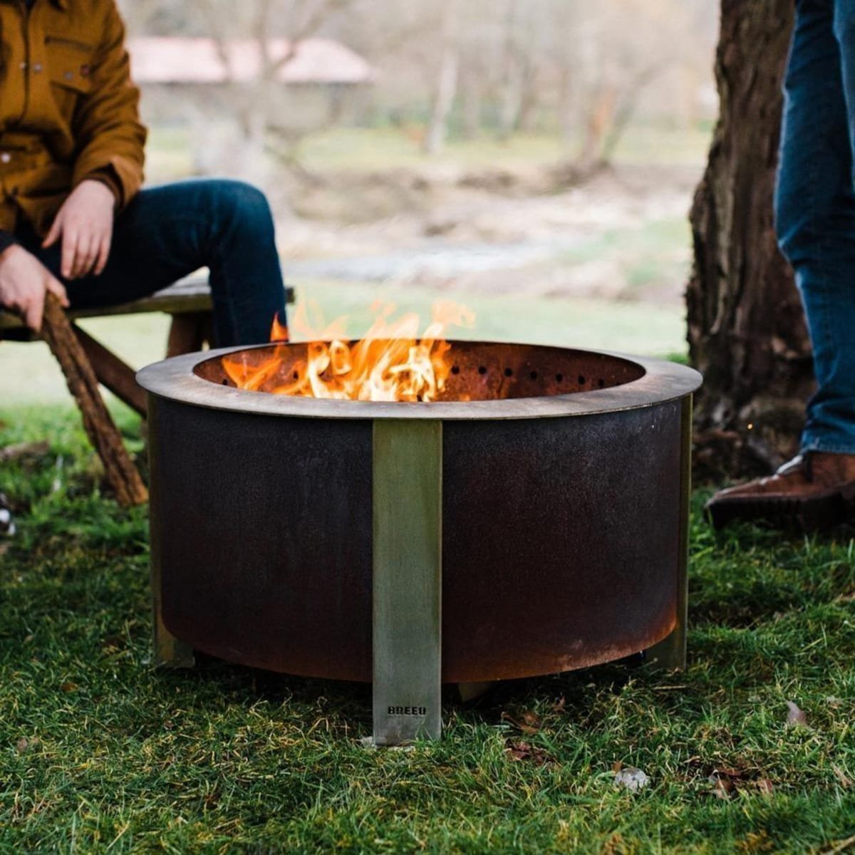 X Series 28 Inch Round Corten Steel Wood-Burning Fire Pit in Stainless Steel by Breeo